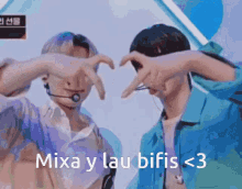 two men are making a heart with their hands and the words mixa y lau bifis < 3