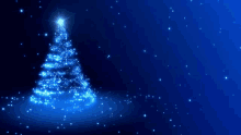 a blue christmas tree with a star on top of it