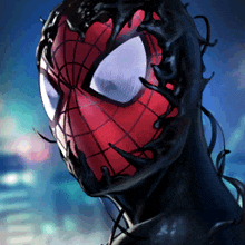 a close up of a spider man 's face with a spider web on it