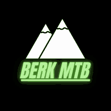 a logo for berk mtb shows a mountain and the words berk mtb