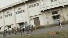 a group of power rangers are walking in front of a building that says nick hd on the bottom