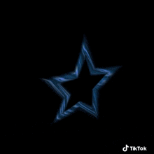 a blue star is spinning on a black background