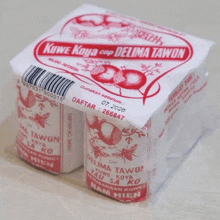 a package of kowe kova cap delima tawon sits on a white surface