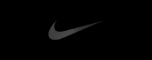 the nike logo is on a black background and appears to be floating in the air .