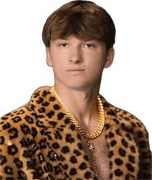 a man wearing a leopard print coat and a gold chain around his neck