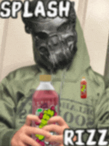 a man wearing a gas mask is holding a bottle of rizz