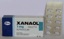 a box of xanaol 1 mg tablets sits next to a blister pack