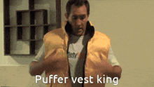 a man is wearing a yellow vest that says " puffer vest king "