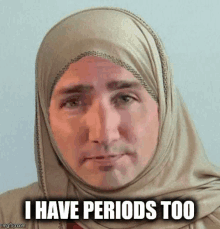 a man wearing a hijab is making a funny face and saying `` i have periods too '' .