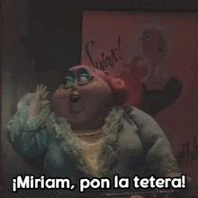 a cartoon character says " miriam pon la tetera " in front of a wink poster