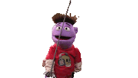 a purple puppet with a skull on his shirt is holding a fishing rod