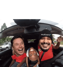 a man wearing a hat that says multivers is sitting in a car with two other people