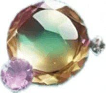 a close up of a pendant with a green and purple stone .