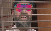 a man with a beard wearing sunglasses that say pittsburgh on them