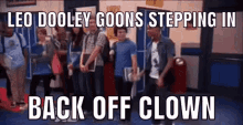 a group of people standing in a hallway with the caption leo dooley goes stepping in back off clown