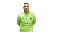 a man wearing a green shirt with the number 16 on the front