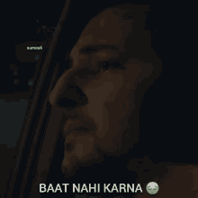 a man looking out of a car window with baat nahi karna written below him