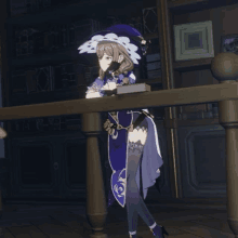 a girl in a witch costume is leaning on a wooden table