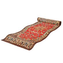 a red rug with a floral pattern is rolled up on a white surface