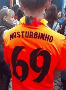 a man wearing a red shirt with the number 69 on the back