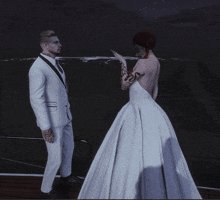 a man in a suit and a woman in a wedding dress are standing on a boat