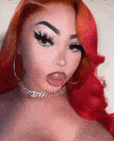 a woman with red hair is wearing a choker necklace and hoop earrings