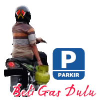 a man is sitting on a motorcycle next to a sign that says parkir