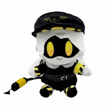 a stuffed animal is wearing a black hat and holding a yellow hose .