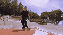 a skateboarder is doing a trick at a skate park with a sign that says " the weed " on it