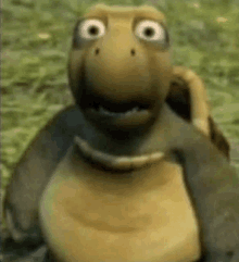 a cartoon turtle is smiling and looking at the camera while standing in the grass .