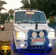 a white police car with a license plate that says kl01ch3916