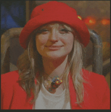 a woman wearing a red hat and a white shirt