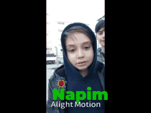 a boy wearing a hooded jacket with the word napim written on it