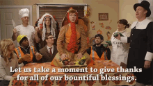 a group of people are gathered around a table with the words " let us take a moment to give thanks "