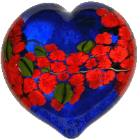 a blue heart shaped object with red flowers on it