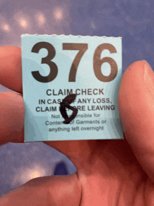 a person is holding a claim check in case of any loss claim more leaving