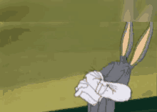 bugs bunny from looney tunes is covering his face with his arms