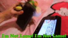 a person playing a video game with the words " i 'm not lame " on the bottom