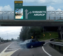 a green highway sign says left exit 12 and shibabets airdrop