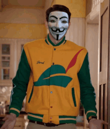 a man wearing a mask and a jacket that says jacob on it