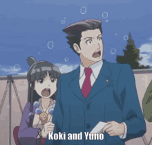 a man and a woman are standing next to each other and the man is saying koki and yuno