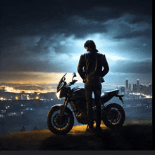 a man stands next to a motorcycle on a hill overlooking a city