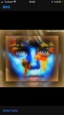 a phone screen shows a painting of a child 's face with a map of the world painted on it