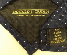 a donald j. trump signature collection tie with white polka dots