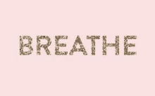 the word breathe is written in gold letters on a pink background .