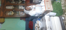 a woman is sitting at a table with a bowl of food