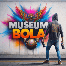 a man is standing in front of a wall that says museum bola on it