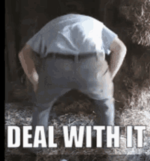 a man standing in front of a pile of hay with the words deal with it written on the bottom