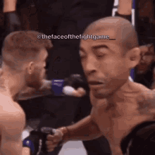 two men are fighting in a boxing ring and one of them is crying