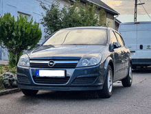 a black car with a license plate that says hungary